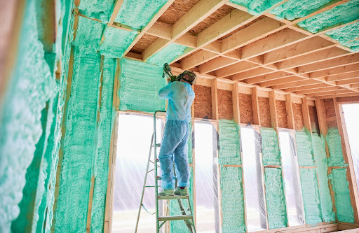 Man installing a spray foam roof 